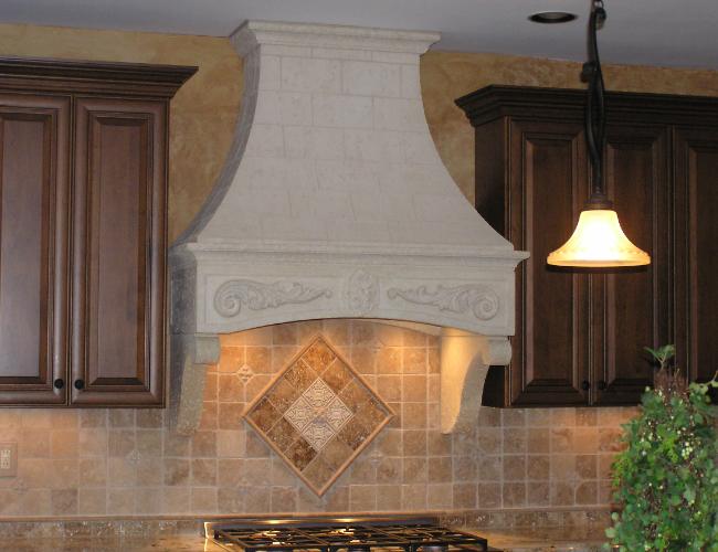 Susan T. Stone Range hood with standard corbels. This Stone hood is 4 pieces plus a Stone Crown molding with return ends for easy install.
